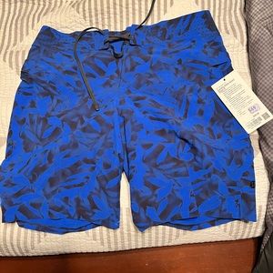 BRAND NEW** Lululemon board shorts 9”. NEVER WORN.